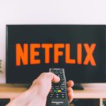 closeup-photo-of-person-holding-panasonic-remote-control-in-9875861