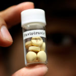 FILE PHOTO: Tablets of Avigan (generic name : Favipiravir), a drug approved as an anti-influenza drug in Japan and developed by drug maker Toyama Chemical Co, a subsidiary of Fujifilm Holdings Co. are displayed during a photo opportunity in Tokyo
