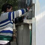 A man draws water from a water ATM in Jaipur. Photo: Nivedita Khandekar