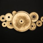 photo-of-golden-cogwheel-on-black-background-37859291