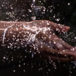 human-hand-under-pouring-water-682621