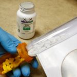 FILE PHOTO: The drug hydroxychloroquine, pushed by U.S. President Donald Trump and others in recent months as a possible treatment to people infected with the coronavirus disease (COVID-19), is displayed by a pharmacist in Provo