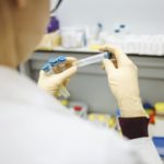 person-holding-test-tubes-3735747