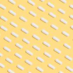 white-capsules-on-yellow-background-3683056