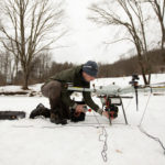 Alex Nikulin prepares a Ukrainian Multirotor Technologies (UMT) Cicada-M drone to fly with a magnetometer to detect abandoned oil wells in Olean, New York