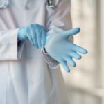 person-wearing-blue-sterile-gloves-3985168