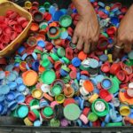 person-hands-on-assorted-color-plastic-lid-lot-761297