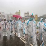 COVID-19 testing during rain in Mumbai