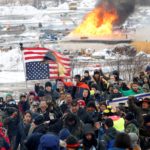FILE PHOTO: Opponents of the Dakota Access oil pipeline march out of their main camp near Cannon Ball
