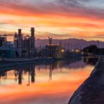 photo-of-building-near-body-of-water-during-golden-hour-2516588