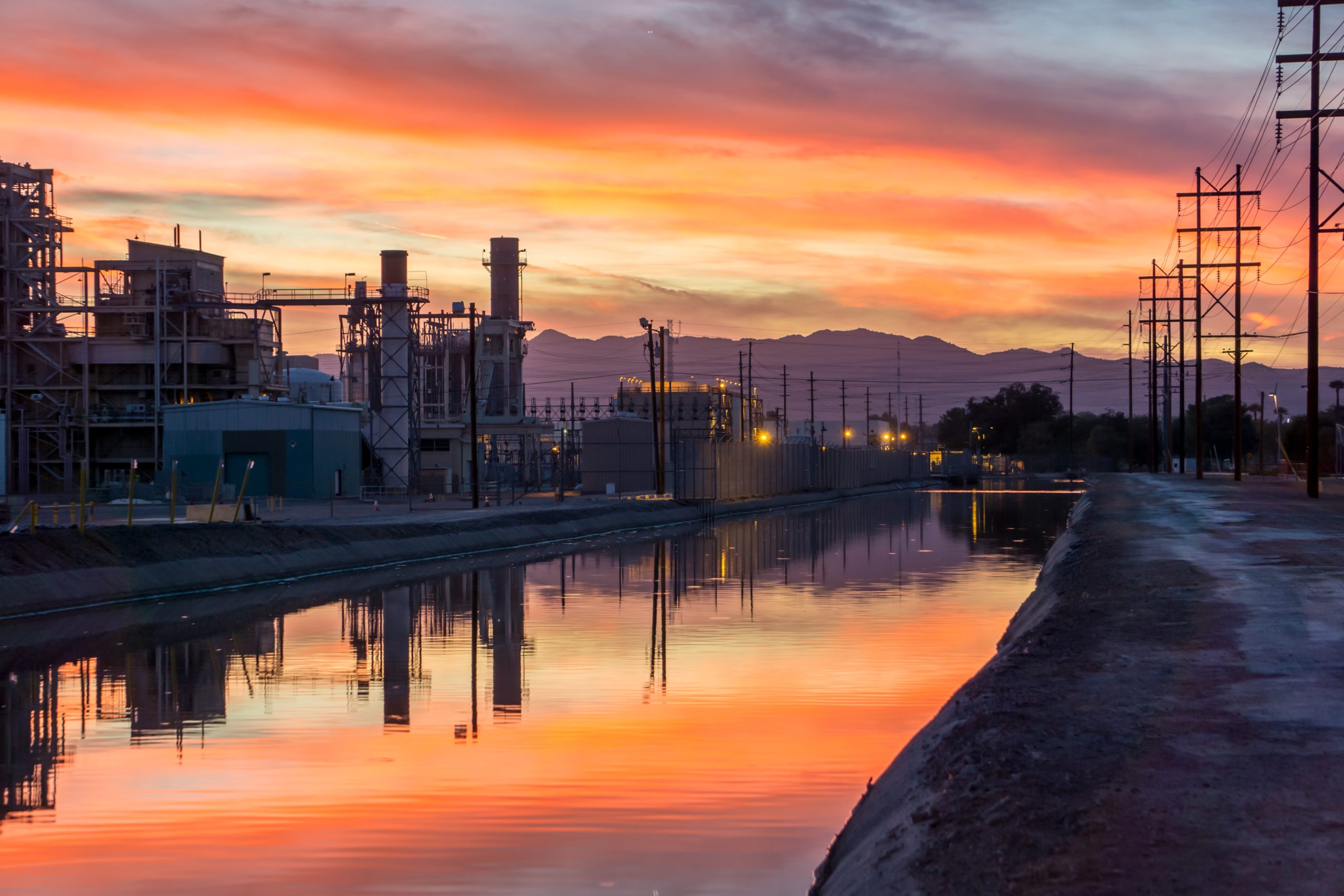 photo-of-building-near-body-of-water-during-golden-hour-2516588