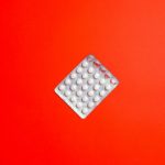 silver-blister-pack-on-red-surface-3683063f