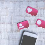 Smart Phone with Paper Cut Social Media Icons in Speech Bubble