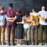 group-of-people-standing-indoors-3184396f