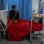 Medical workers treat patients infected with the coronavirus disease (COVID-19) at a hospital in New Delhi