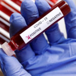 Fake blood is seen in test tubes labelled with the coronavirus (COVID-19) in this illustration