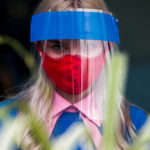 FILE PHOTO: A restaurant employee wears a protective face shield and mask due to the coronavirus disease (COVID-19) outbreak in Moscow