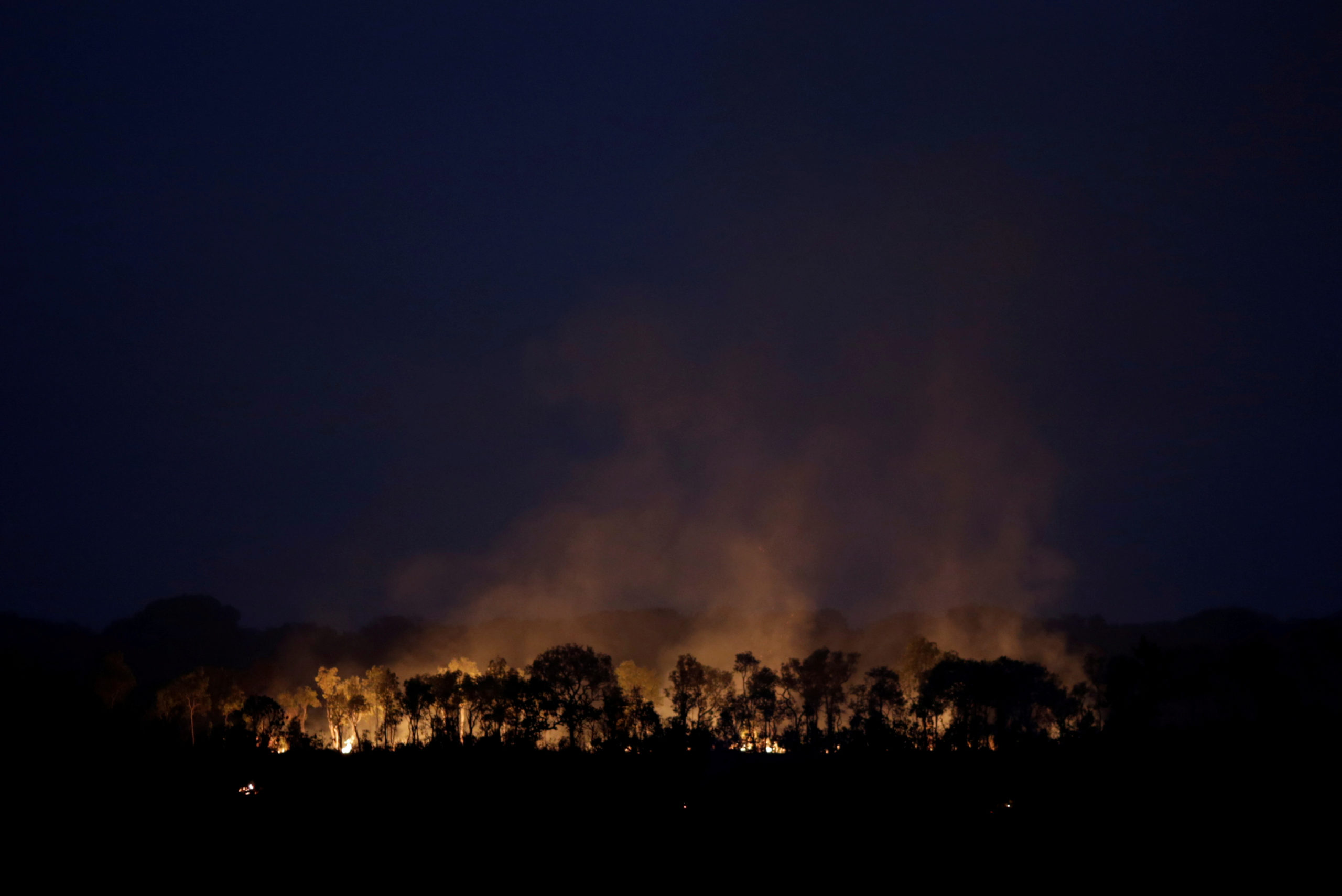 A tract of the Amazon jungle is seen burning as it is cleared by loggers and farmers near Humaita