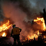 A IBAMA fire brigade member attempts to control a fire in a tract of the Amazon jungle in Apui