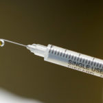 A syringe with a vaccine is seen ahead of trials by volunteers testing for the coronavirus disease (COVID-19), and taking part in the country's human clinical trial for potential vaccines at the Wits RHI Shandukani Research Centre in Johannesburg