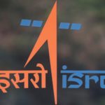 A security guard stands behind the logo of Indian Space Research Organisation (ISRO) at its headquarters in Bengaluru