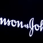 The company logo for Johnson & Johnson is displayed on a screen to celebrate the 75th anniversary of the company's listing at the NYSE in New York