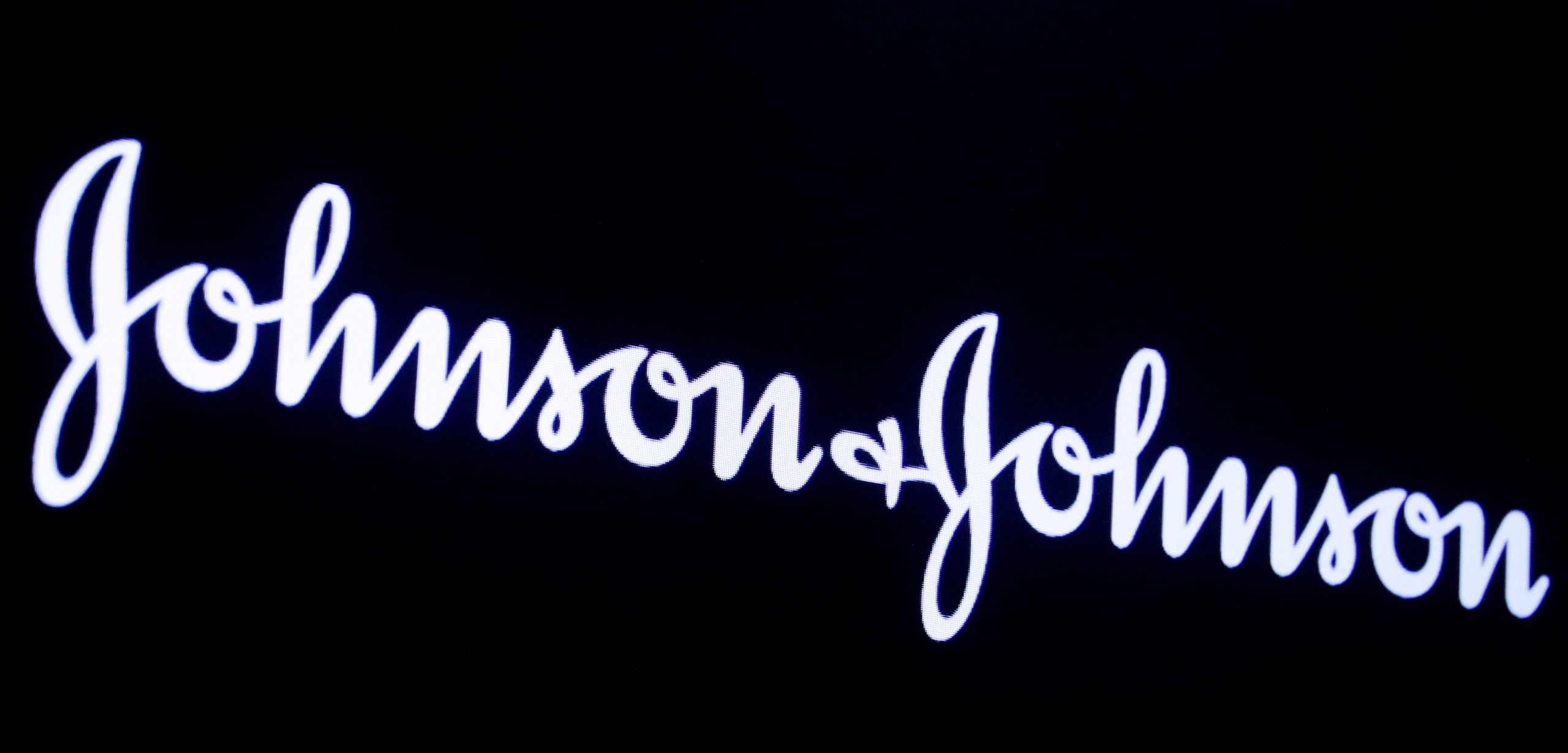 The company logo for Johnson & Johnson is displayed on a screen to celebrate the 75th anniversary of the company's listing at the NYSE in New York