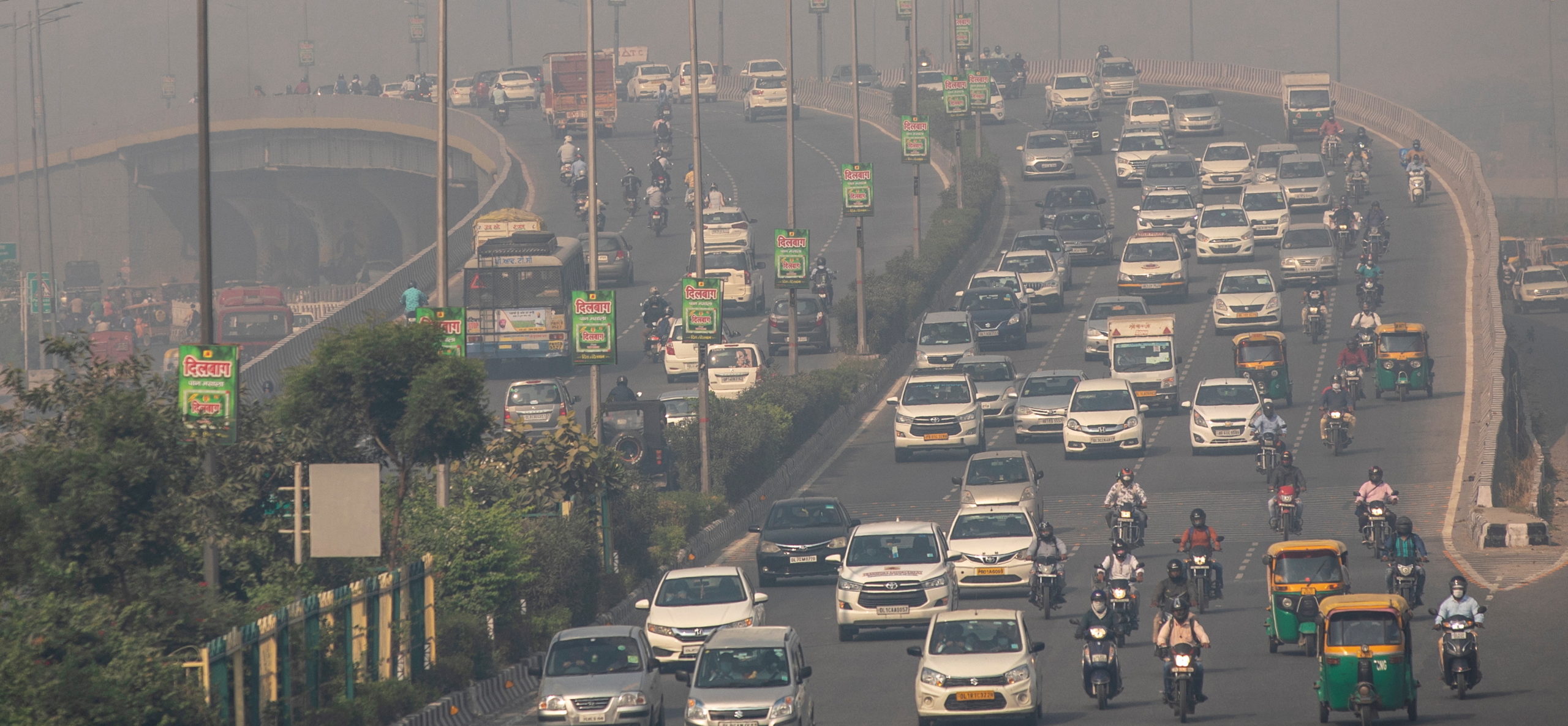 Traffic moves on a smoggy morning in New Delhi
