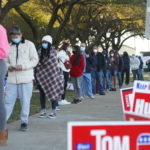 People line up outside a polling station during the Election Day in Houston