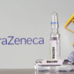 FILE PHOTO: A test tube labelled with the vaccine is seen in front of AstraZeneca logo in this illustration taken