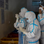Medical workers treat patients infected with the coronavirus disease (COVID-19) at a hospital in New Delhi