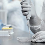 FILE PHOTO: A researcher works in a lab run by Moderna