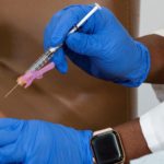 FILE PHOTO: Healthcare workers receive the Moderna COVID-19 vaccine in New York City