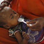 A mother feeds her malnourished child in the Nutritional Rehabilitation Centre of Sheopur district