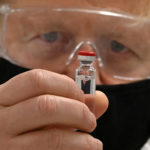 FILE PHOTO: Britain's PM Johnson sees coronavirus vaccine manufacturing process in Wrexham