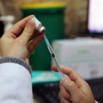 FILE PHOTO: A medical worker prepares a vaccination against the coronavirus disease (COVID-19) as Israel continues its national vaccination drive, in East Jerusalem