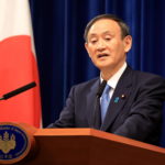 Japanese Prime Minister Yoshihide Suga holds a New Year's press conference at his official residence in Tokyo