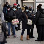 FILE PHOTO: People wait in line to get tested for the coronavirus disease (COVID-19) in the Bronx
