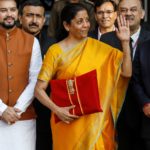 India's Finance Minister Nirmala Sitharaman holds budget papers as she leaves her office to present the federal budget in the parliament in New Delhi