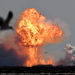 The SpaceX Starship SN9 explodes into a fireball after its high altitude test flight from test facilities in Boca Chica