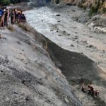 Members of Indo-Tibetan Border Police search for survivors after a Himalayan glacier broke and swept away a small hydroelectric dam, in Chormi