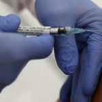 FILE PHOTO: CureVac's experimental COVID-19 vaccine is given to a volunteer in clinical trials
