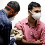 A medic administers COVAXIN to a health worker during its trials, at the Gujarat Medical Education & Research Society in Ahmedabad.