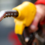 An attendant prepares to refuel a car at a petrol station in Rome. Photo: Reuters/Max Rossi/File Photo