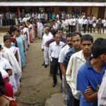 Voters line up to cast their vote outside a polling station in Assam in 2014. Photo: Reuters
