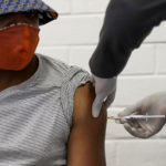 A volunteer receives an injection from a medical worker during the country's first human clinical trial for a potential vaccine against the novel coronavirus, at Baragwanath Hospital in Soweto, South Africa. Photo:Reuters/Siphiwe Sibeko/File Photo