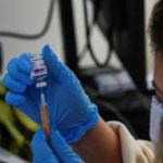A dose of AstraZeneca vaccine is prepared at a COVID-19 vaccination centre in Maidstone, Britain. Photo: Reuters/Andrew Couldridge
