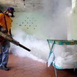 A worker from the municipality carries out fumigation to help control the spread of Chikungunya and dengue fever, which are caused by viruses carried by mosquitoes. Photo: Reuters/Carlos Garcia Rawlins