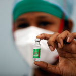 FILE PHOTO: A nurse displays a vial of COVISHIELD, the AstraZeneca COVID-19 vaccine manufactured by Serum Institute of India, in Mumbai