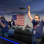 Members of NASA’s Perseverance rover team react in mission control after receiving confirmation the spacecraft successfully touched down on Mars